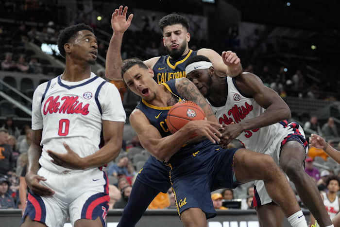 Dec 16, 2023; San Antonio, Texas, USA; California Golden Bears guard Jaylon Tyson (20) battles for the ball between Mississippi Rebels guards Brandon Murray (0) and Cole McGrath (30) at the Frost Bank Center. Mandatory Credit: Daniel Dunn-USA TODAY Sports